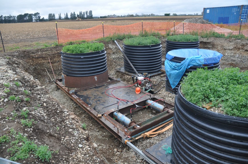 Installing large lysimeters containing undisturbed soil monoliths established with lucerne for direct measurements of carbon and nitrogen leaching. The lysimeters are 2 m in diameter and 1.5 m deep. Note the high stone content of the soil (John Payne)