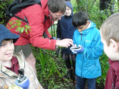 Murray in the field with students.