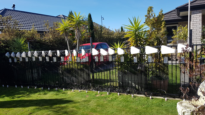 Directional antennae tied to the garden fence.