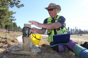 Dr Grant Norbury preparing a camera trap, Tekapo