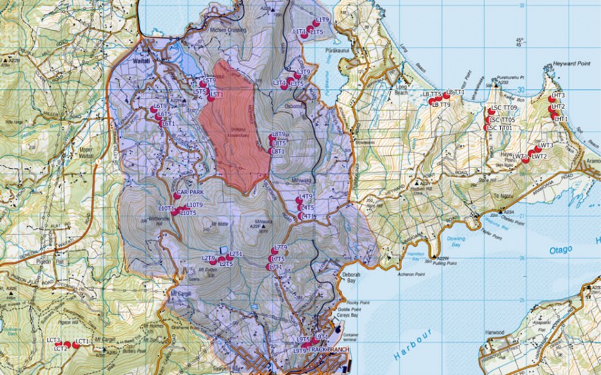 Figure 1: Map of camera trapping network. Each camera is labelled, the Halo region is shaded purple/violet, and the Orokonui fenced sanctuary is shaded red.