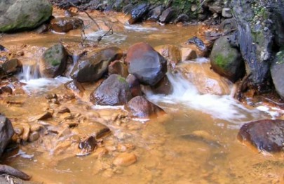 Acid mine drainage from coal mine.