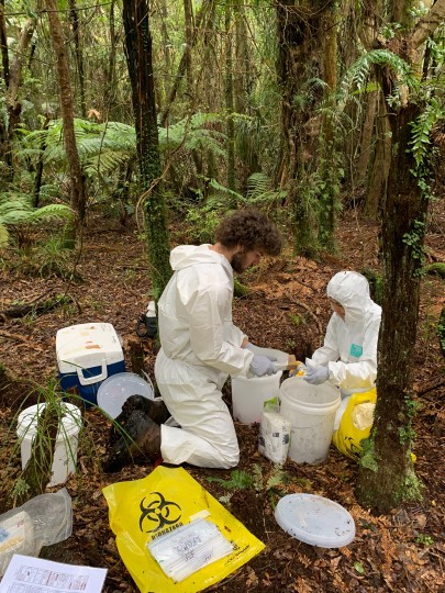 Manaaki Whenua technicians James Arbuckle and Dr Chantal Probst washing equipment used to sample soil for microbial dna