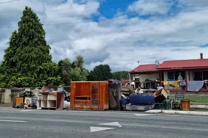 Flood-damaged property piled up on the streets of Omāhu in Hawke’s Bay.