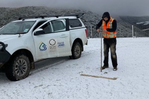 Balin Robertson collecting soil samples by auger in Mokoreta, Southland.