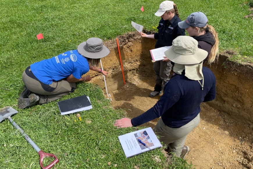 Figure 1. Manaaki Whenua – Landcare Research pedologist Dr Kirstin Deuss (left) explains some of the features of a Pallic Orthic Brown Soil to students from Lincoln University. (Photo: Carol Smith)