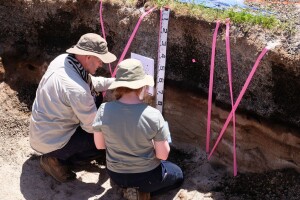 Post-grad students from the Australian National University up close and personal with a buried-pumice Tephric Recent soil at Rerewhakaaitu, south of Rotorua.