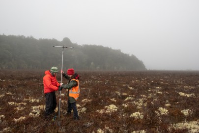 Researchers Jamie Wood and Michelle McKeown collecting a wetland soil core. Researchers Jamie Wood and Michelle McKeown collecting a wetland soil core.
